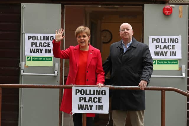 SNP leader Nicola Sturgeon and the party's chief executive, her husband Peter Murrell, leave a polling station at Broomhouse Park Community Hall in Edinburgh after casting their votes in last year's European Parliament elections (Picture: Andrew Milligan/PA Wire)