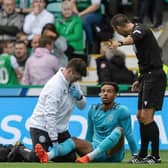 Hibs' Jojo Wollacott is forced off with an injury during his side's Europa Conference League qualifier win over Inter Club d'Escaldes at Easter Road,. Photo by Mark Scates / SNS Group