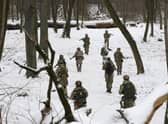 Members of Ukraine's Territorial Defense Forces, volunteer military units of the Armed Forces, train in a city park in Kyiv, Ukraine.  (AP Photo/Efrem Lukatsky)
