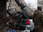 A military stands at the site where a helicopter crashed near a kindergarten outside the capital Kyiv, killing Sixteen people, including two children and Ukrainian interior minister, on January 18, 2023, amid the Russian invasion of Ukraine. (Photo by Sergei Supinsky / AFP) (Photo by SERGEI SUPINSKY/AFP via Getty Images)