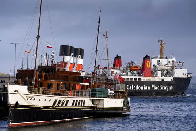 Waverley docked in Brodick today as a CalMac ferry leaves for Ardrossan. Picture: Jeff J Mitchell/Getty Images