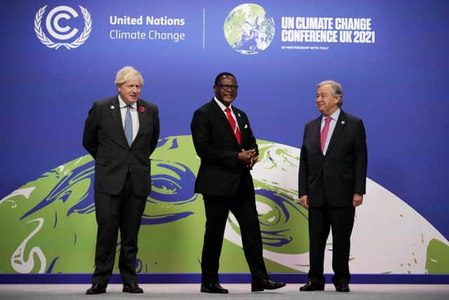 Boris Johnson, Malawi's President Lazarus Chakwera and United Nations' Secretary General Antonio Guterres at the COP26 climate summit earlier this week (Picture: Christopher Furlong/pool/AFP via Getty Images)
