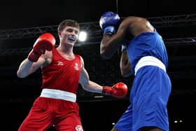 Sam Hickey (red) of Scotland enroute to victory over Adeyinka Benson (blue) of Nigeria during the Men’s Boxing Over 71kg-75kg Middleweight Quarter-Final match on day six of the Birmingham 2022 Commonwealth Games. (Photo by Eddie Keogh/Getty Images)