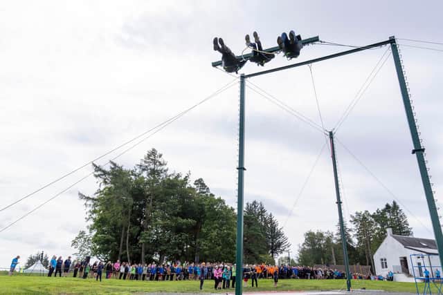 Young Scouts try out the new giant swing at Auchengillan