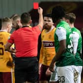 Motherwell's Liam Donnelly (centre) is sent off during a cinch Premiership against Hibs.