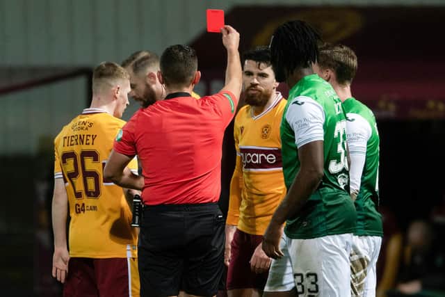 Motherwell's Liam Donnelly (centre) is sent off during a cinch Premiership against Hibs.