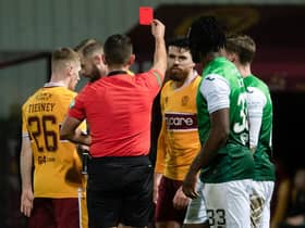 Motherwell's Liam Donnelly (centre) is sent off during a cinch Premiership against Hibs.