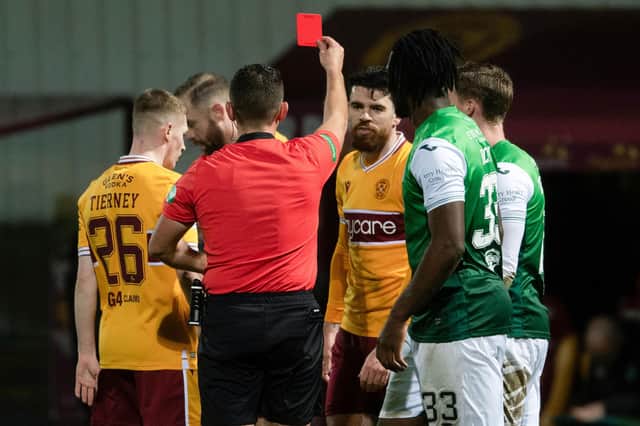 Motherwell's Liam Donnelly (centre) is sent off during a cinch Premiership against Hibs.