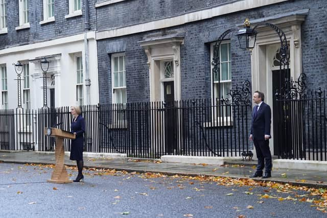 Liz Truss, with her husband Hugh O'Leary, making a statement outside 10 Downing Street, London, where she announced her resignation as Prime Minister. Picture: Stefan Rousseau/PA Wire