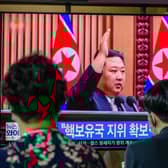 Kim Jong Un is shown on a television screen at a train station in Seoul after passing a law allowing it to carry out a preventive nuclear strike 
(Photo by ANTHONY WALLACE/ Getty Images)
