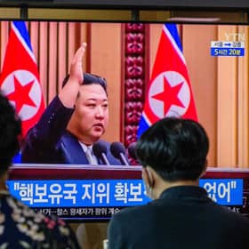 Kim Jong Un is shown on a television screen at a train station in Seoul after passing a law allowing it to carry out a preventive nuclear strike 
(Photo by ANTHONY WALLACE/ Getty Images)