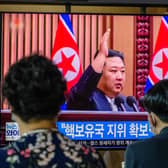 Kim Jong Un is shown on a television screen at a train station in Seoul after passing a law allowing it to carry out a preventive nuclear strike 
(Photo by ANTHONY WALLACE/ Getty Images)