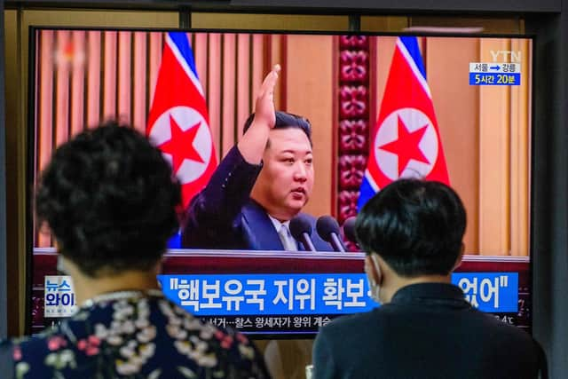 Kim Jong Un is shown on a television screen at a train station in Seoul after passing a law allowing it to carry out a preventive nuclear strike 
(Photo by ANTHONY WALLACE/ Getty Images)