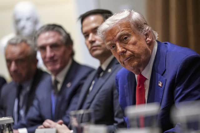 President Donald Trump, from right, Secretary of State Marco Rubio, Interior Secretary Doug Burgum and Health and Human Services Secretary Robert F. Kennedy, Jr., attend a cabinet meeting at the White House in Washington, D.C., U.S., April 10, 2025. REUTERS/Nathan Howard