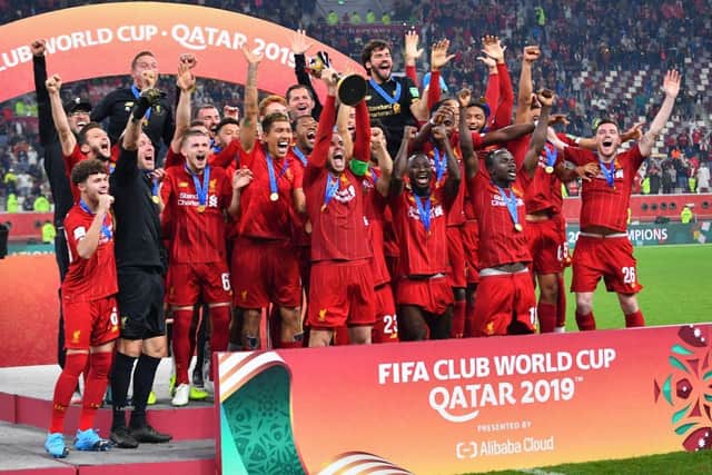 Liverpool captain Jordan Henderson lifts the 2019 FIFA Club World Cup trophy. (Pic: Getty Images)