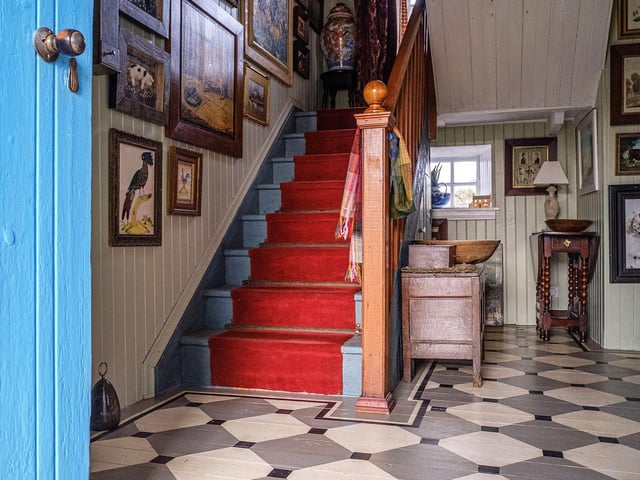 . A traditional, early 20th century croft house on the north east coast of Lewis, New Tolsta in Stornoway is home to artist Tom.