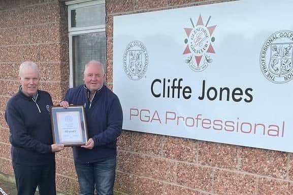 Long-serving Glencorse professional Cliffe Jones receives his PGA certificate from BBC Scotland sports reporter Brian McLauchlin.