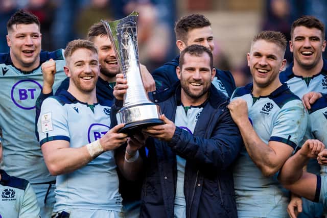 Kyle Steyn (left) and Fraser Brown (centre) with the Auld Alliance trophy
