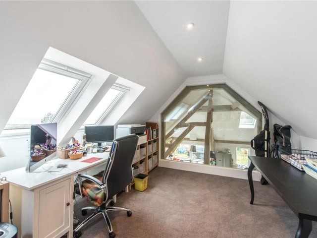 Upper office/sitting area with fantastic glass wall overlooking the kitchen.
