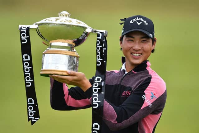 Min Woo Lee of Australia celebrates with the trophy after winning the abrdn Scottish Open at The Renaissance Club. Picture: Mark Runnacles/Getty Images.