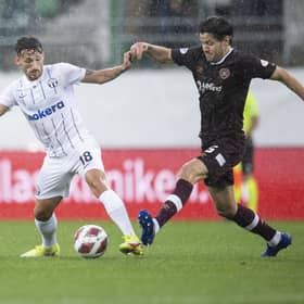 Zurich's Donis Avdijaj fights for the ball with Hearts midfielder Peter Haring. Pic: Ennio Leanza/Keystone via AP