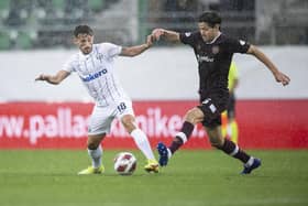 Zurich's Donis Avdijaj fights for the ball with Hearts midfielder Peter Haring. Pic: Ennio Leanza/Keystone via AP