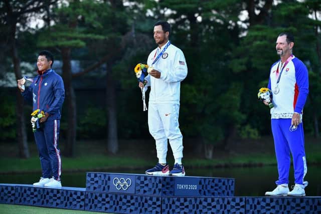 New Olympic champion Xander Schauffele, centre, is flanked by bronze medallist C. T. Pan, left, and silver medallist Rory Sabbatini on the podium at the medal ceremony of the mens golf event during the Tokyo 2020 Olympic Games at the Kasumigaseki Country Club on Sunday. Picture: Kazuhiro Nogi/AFP via Getty Images.