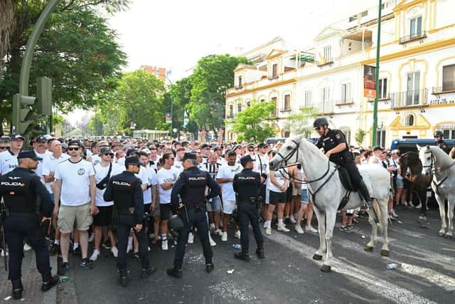 Eintracht Frankfurt fans arrive at the stadium as police on horseback look on prior to the UEFA Europa League final match between Eintracht Frankfurt and Rangers FC at Estadio Ramon Sanchez Pizjuan on May 18, 2022 in Seville, Spain. (Photo by David Ramos/Getty Images)