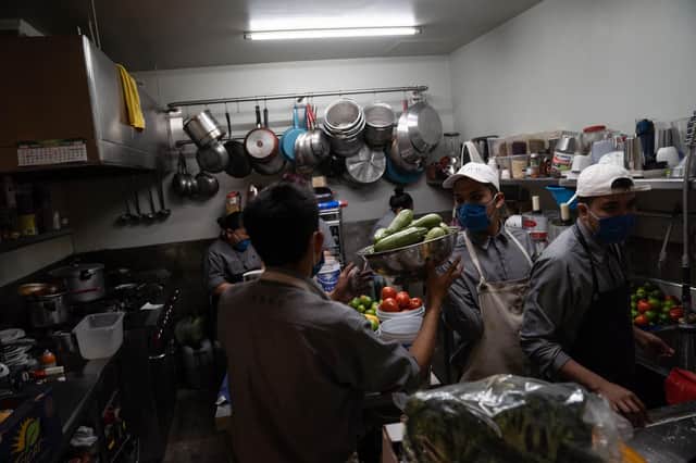 Busy kitchen receiving deliveries (Photo by Toya Sarno Jordan/Getty Images)
