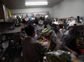 Busy kitchen receiving deliveries (Photo by Toya Sarno Jordan/Getty Images)