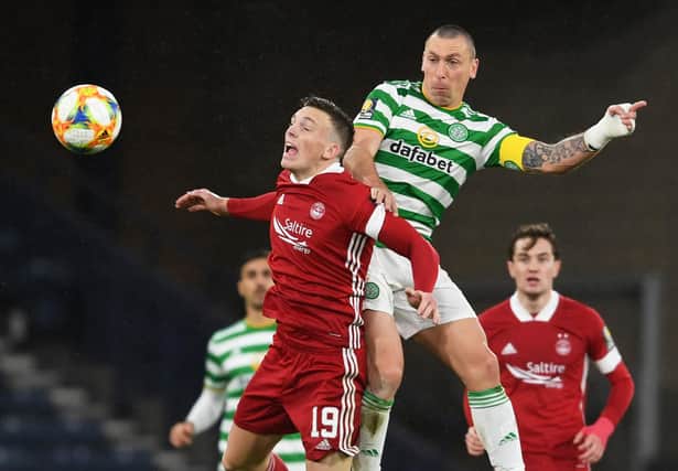 Celtic's Scott Brown wins an aerial challenge with Lewis Ferguson during a dominant Scottish semi-final display over Aberdeen that bolsters his claim for a final place. (Photo by Craig Foy / SNS Group)
