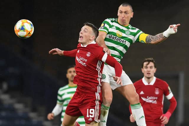 Celtic's Scott Brown wins an aerial challenge with Lewis Ferguson during a dominant Scottish semi-final display over Aberdeen that bolsters his claim for a final place. (Photo by Craig Foy / SNS Group)