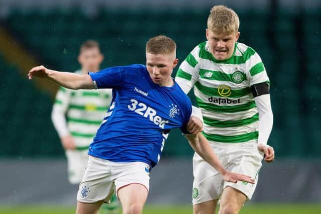 Rangers' Stephen Kelly competes with Stephen Welsh in 2019. (Picture: SNS)