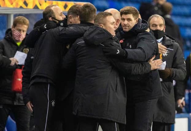 Rangers manager Steven Gerrard celebrates with his coaching staff after the 3-2 victory over Standard Liege which sealed the Ibrox club's place in the last 32 of the Europa League. (Photo by Alan Harvey / SNS Group)