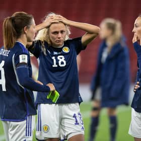 Scotland's Rachel Corsie attemps to console a crestfallen Claire Emslie and Caroline Weir at full time. (Photo by Mark Scates / SNS Group)