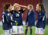 Scotland's Rachel Corsie attemps to console a crestfallen Claire Emslie and Caroline Weir at full time. (Photo by Mark Scates / SNS Group)