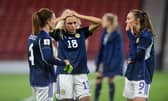 Scotland's Rachel Corsie attemps to console a crestfallen Claire Emslie and Caroline Weir at full time. (Photo by Mark Scates / SNS Group)