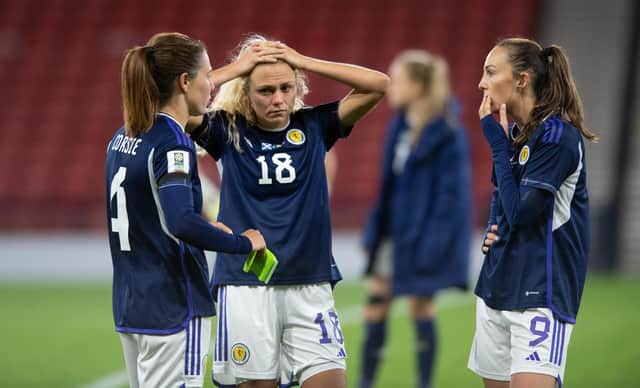 Scotland's Rachel Corsie attemps to console a crestfallen Claire Emslie and Caroline Weir at full time. (Photo by Mark Scates / SNS Group)