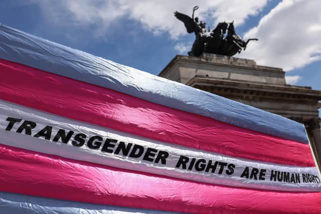 Demonstrators hold a banner ahead of the London Trans Pride protest in London. Picture: Hollie Adams/Getty Images