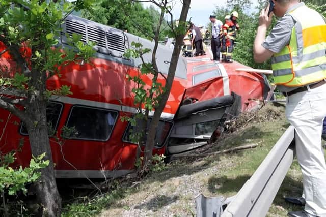 At least three people were killed and several others injured as a train derailed near a Bavarian Alpine resort in southern Germany, police said. (Photo by NETWORK PICTURES / AFP)