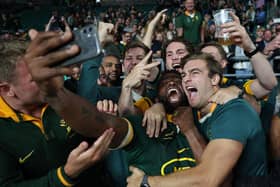 South Africa captain Siya Kolisi celebrates with supporters as he takes a selfie after the record-breaking win over New Zealand at Twickenham.  (Photo by Adrian Dennis/AFP via Getty Images)