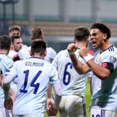 Scotland's Che Adams (right) celebrates scoring the second goal in the 2-0 win in Moldova. Pic: Tim Goode/PA Wire