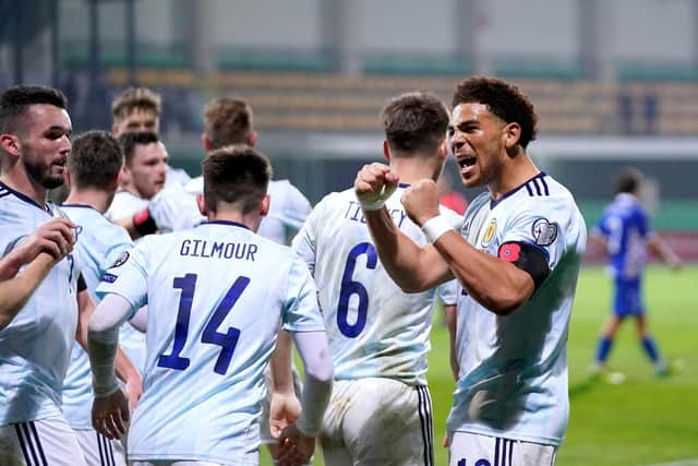 Scotland's Che Adams (right) celebrates scoring the second goal in the 2-0 win in Moldova. Pic: Tim Goode/PA Wire