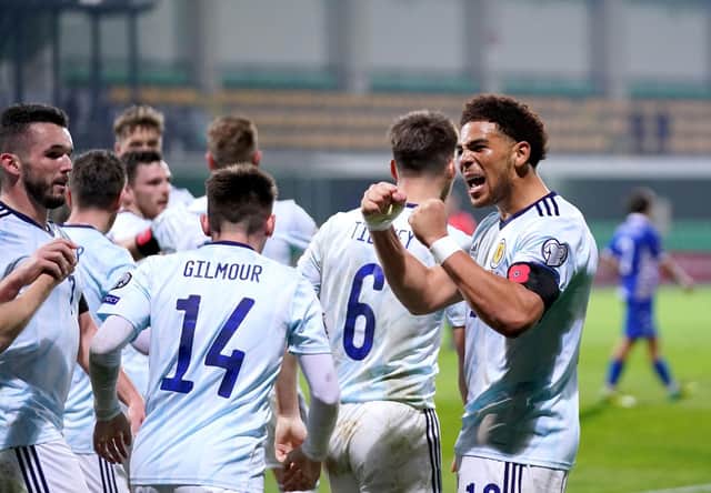 Scotland's Che Adams (right) celebrates scoring the second goal in the 2-0 win in Moldova. Pic: Tim Goode/PA Wire