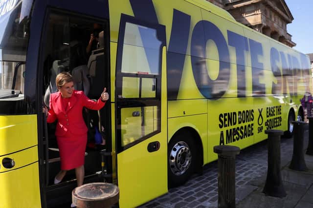 First Minister Nicola Sturgeon gestures as she departs after attending the Scottish National Party (SNP) manifesto launch on April 22, 2022 in Greenock