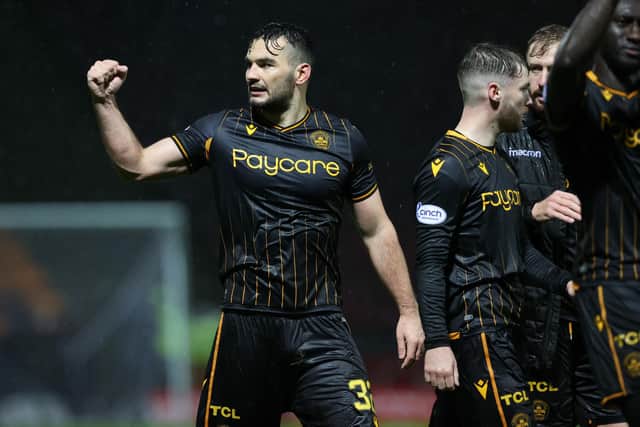 Motherwell's Tony Watt celebrates at full time.