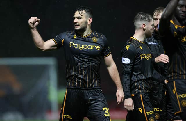 Motherwell's Tony Watt celebrates at full time.