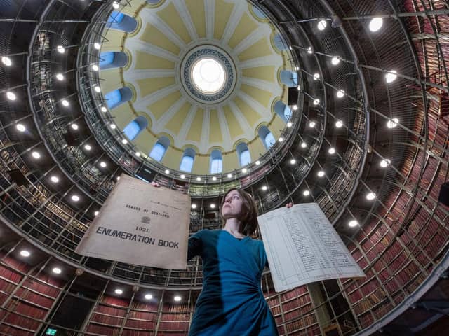 Jocelyn Grant, archivist with National Records of Scotland, with the original documents of the 1921 census. PIC: NRS.
