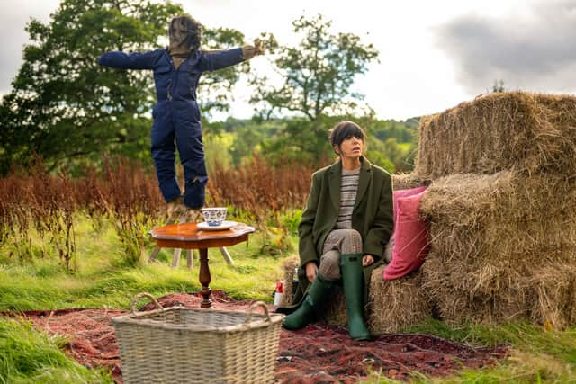 Claudia Winkleman wears Officine Generale coat £1,320; Brora jumper, £185; Cordings Wincanton check trousers, £179; Hunter wellies, £125. Credit: BBC/Studio Lambert/LLARA PLAZA