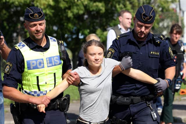 Greta Thunberg, seen being arrested in Malmo during a protest, may not be everyone's cup of tea, but that doesn't disprove climate science (Picture: Andreas Hillergren/TT News Agency/AFP via Getty Images)